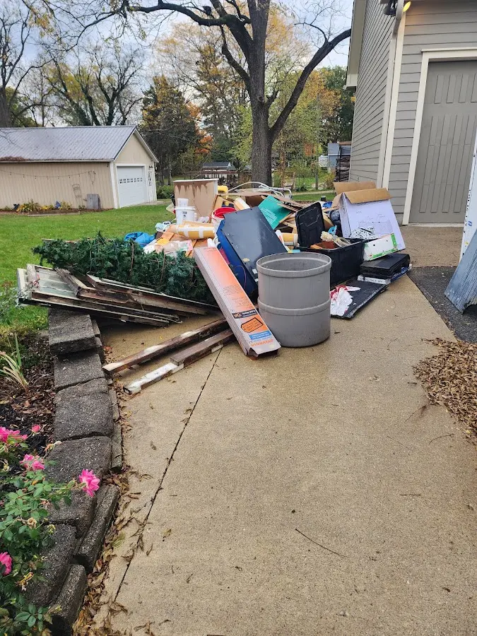 Dumpster being loaded with debris for Estate Cleanout Dumpster Rental in Wadsworth